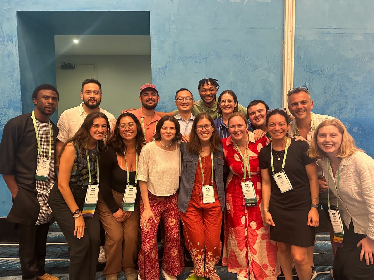 Mengye Chen with colleagues at a research conference